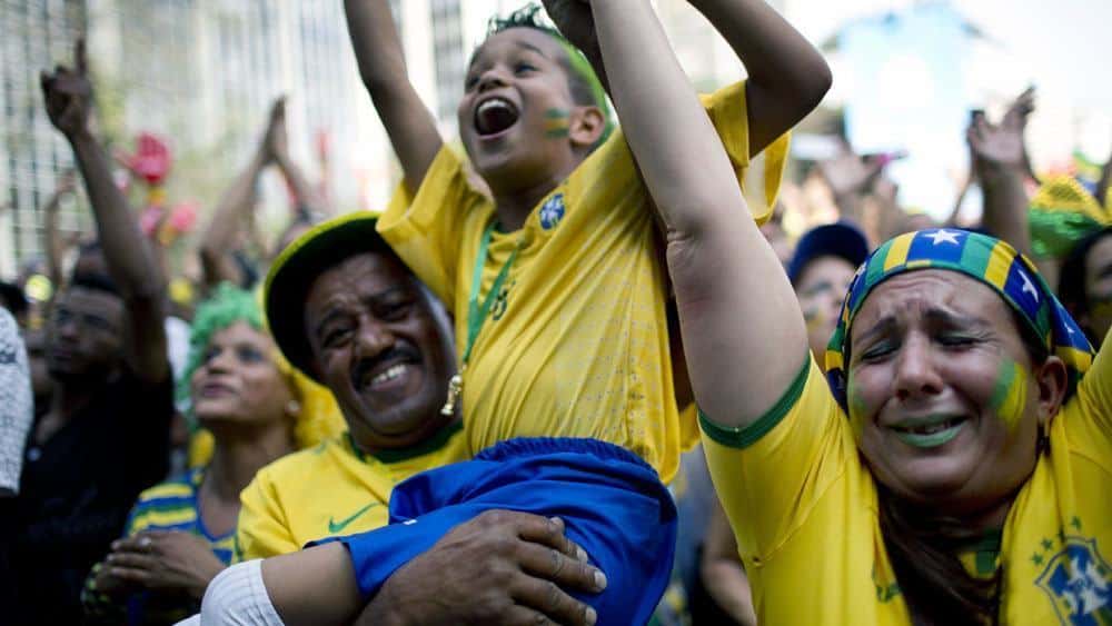 Brazil fans react during a live broadcast of the World Cup round of 16 match between Brazil and Chile, inside the FIFA Fan Fest area in Sao Paulo, Brazil, Saturday, June 28, 2014. (AP Photo/Rodrigo Abd)
